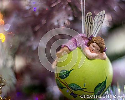 Fairy christmas ball suspended from the fir tree Stock Photo