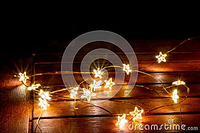 Fairy lights for christimas as illuminated decoration for christmas tree or as festive lights on the table create a romantic mood Stock Photo