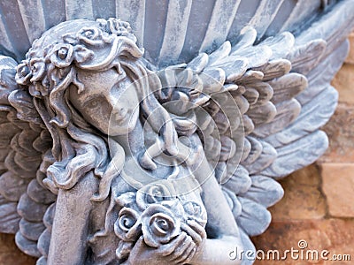 Fairy statue decor on the stone texture wall Stock Photo