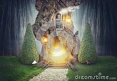 Fairy tree house in dark fantasy forest Stock Photo