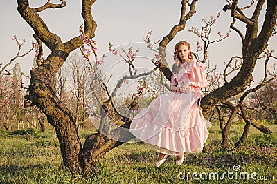 Fairytale woman on the tree branch Stock Photo