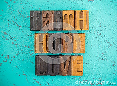 Faith Hope and Love Spelled in Wooden Type Set Block Letters Stock Photo