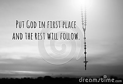 Faith inspirational quote - Put God in first place and the rest will follow. With rosary and Jesus Christ holy cross crucifix Stock Photo