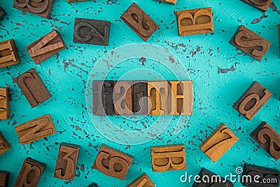 Faith Spelled in Wooden Type Set Block Letters Stock Photo