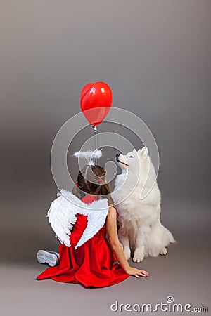 Faithful friends, a girl and a dog. Friendship symbol Stock Photo