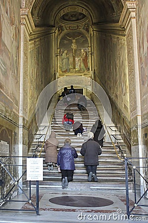 Faithful to his knees praying on holy steps Editorial Stock Photo