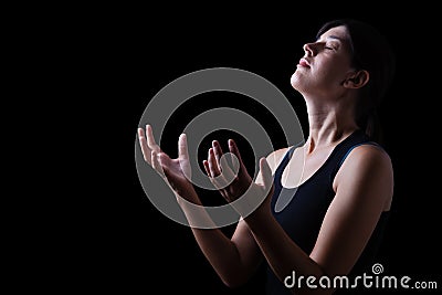 Faithful woman praying and feeling the presence or being touched by god Stock Photo