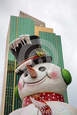 Fake Christmas snowman with city view Editorial Stock Photo