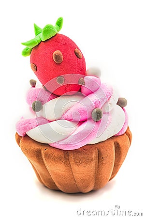 Fake clay cupcake craft with pink and white creme and a strawberry on the top isolated on white background Stock Photo