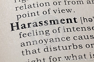 Definition of harassment Stock Photo