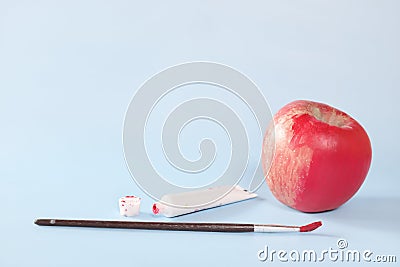 Fake food, coloring, fraud and fraudulent food concept. Apple painted red. Stock Photo