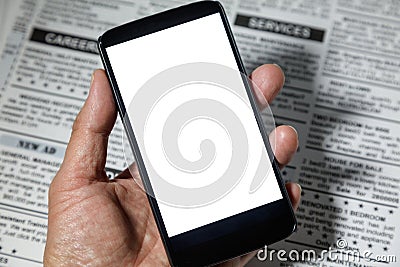 Fake newspaper and smartphone Stock Photo