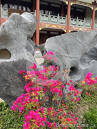 Fake rocks and flower mirrors in a Chinese garden Stock Photo