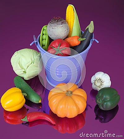 Fake vegetables in bucket Stock Photo