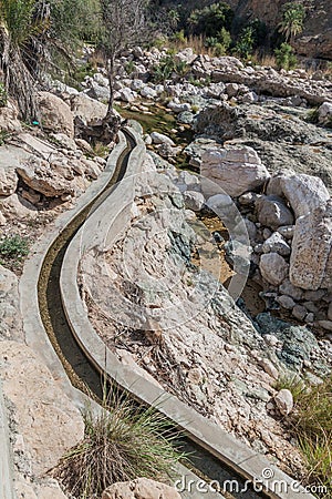 Falaj water channel in Wadi Tiwi valley, Om Stock Photo