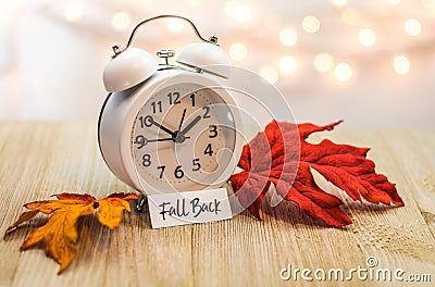 Fall Back Daylight Saving Time concept on wooden board Stock Photo