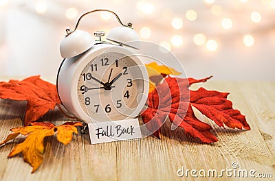 Fall Back Daylight Saving Time concept on wooden board Stock Photo