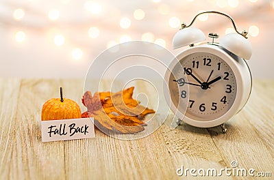 Fall Back Daylight Saving Time concept on wooden board Stock Photo