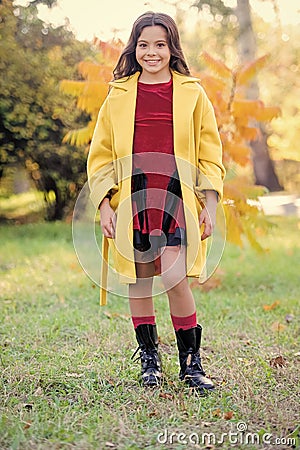 Fall bucket list. Child cheerful on fall walk. Warm coat best choice for autumn. Autumn season concept. Kid girl wear Stock Photo