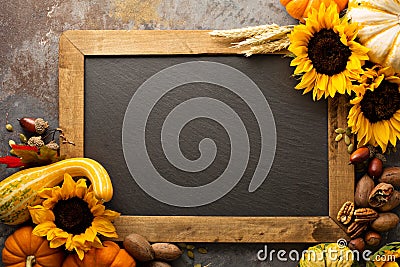 Fall chalkboard copy space with pumpkins and sunflowers Stock Photo