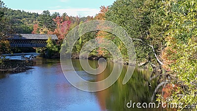 Fall colors around the henniker covered bridge and the contoocook river Stock Photo