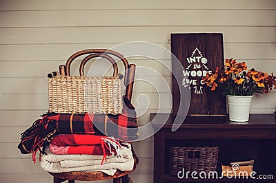 Fall at country house. Seasonal rustic decorations with cozy blankets and flowers Stock Photo