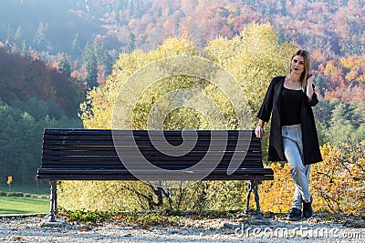 A fall day through the woods somewhere in Transylvania with a beautiful girl Stock Photo