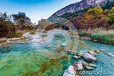 Fall foliage on the crystal clear Frio River in Texas. Stock Photo