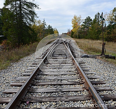 Train track junction in ADK at Big Moose Station Stock Photo