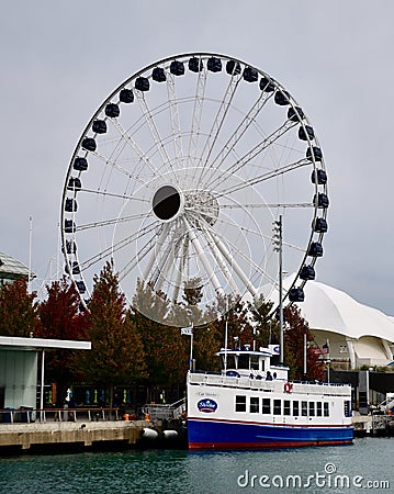 A Small Cruse Ship Docked Along Navy Pier Editorial Stock Photo