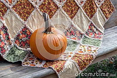 Fall Pumpkin and quilt, a beautiful autumn still life Stock Photo