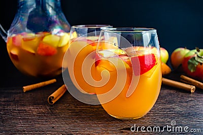 Glasses of Sangria With White Wine, Apples, Pears, and Cinnamon Stock Photo