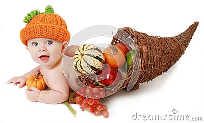 Fall Thanksgiving Baby in a Cornucopia Stock Photo