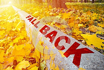 Fall Time Change concept. Yellow Leaves and words Fall Time on c Stock Photo