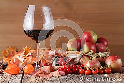 Fall wine in glass on rustic wooden background Stock Photo