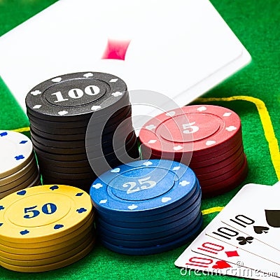 Falling ace behind the bright columns of poker chips Stock Photo