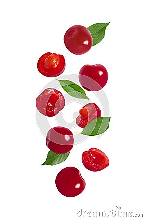 Falling cherry with green leaves isolated on a white background. Flying red berries pattern. Sliced and whole ripe cherries Stock Photo