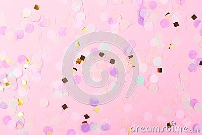 Falling colorful confetti on pink background Stock Photo