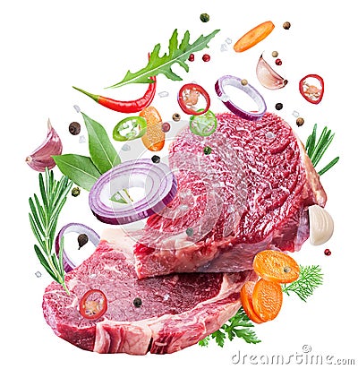 Falling down meat steaks and spices. Flying motion effect of cooking process Stock Photo