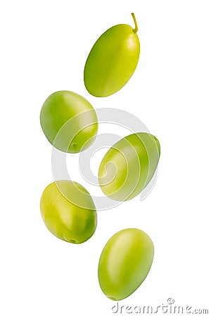 Falling green pickled olives isolated on white background. Stock Photo