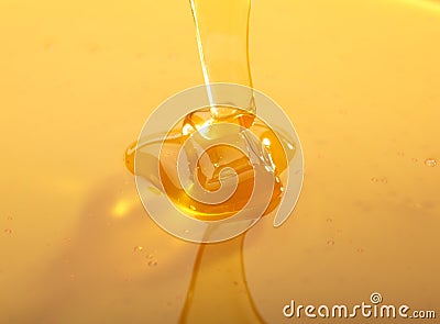 Falling honey trickle Stock Photo