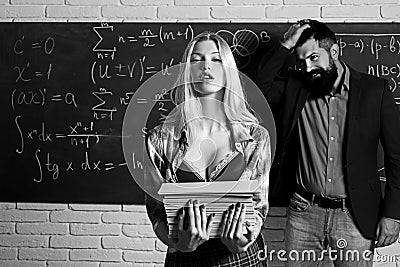 Falling in love in university. Workplace romance of handsome man and sexy woman in university. Couple in love. Female Stock Photo