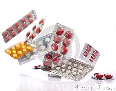 Falling medicine pills blister packs Stock Photo