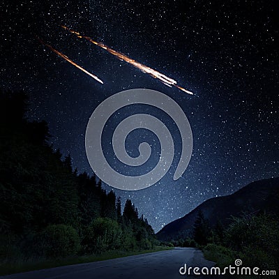 Falling meteorite, asteroid, comet on Earth. Elements of this image furnished by NASA. Stock Photo