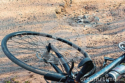 Falling off the bike, potholes and pits on the road, the cyclist fell Editorial Stock Photo