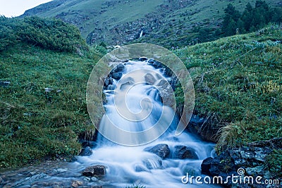 Falling river in the alpine meadows of the Caucasus Mountains Stock Photo