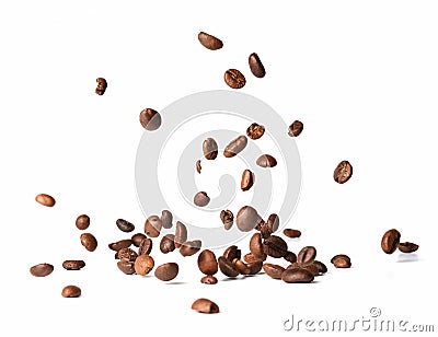 Falling roasted coffee beans. Chaotic motion. White isolated background. Stock Photo