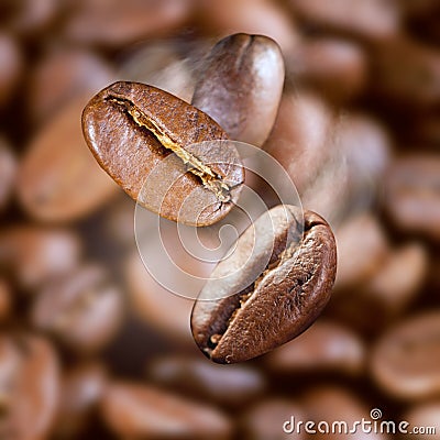 Falling roasted coffee beans Stock Photo