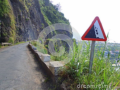 Falling rock road sign on coast road Stock Photo