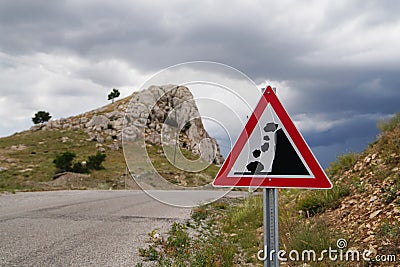 Falling rocks of landslide road sign Stock Photo